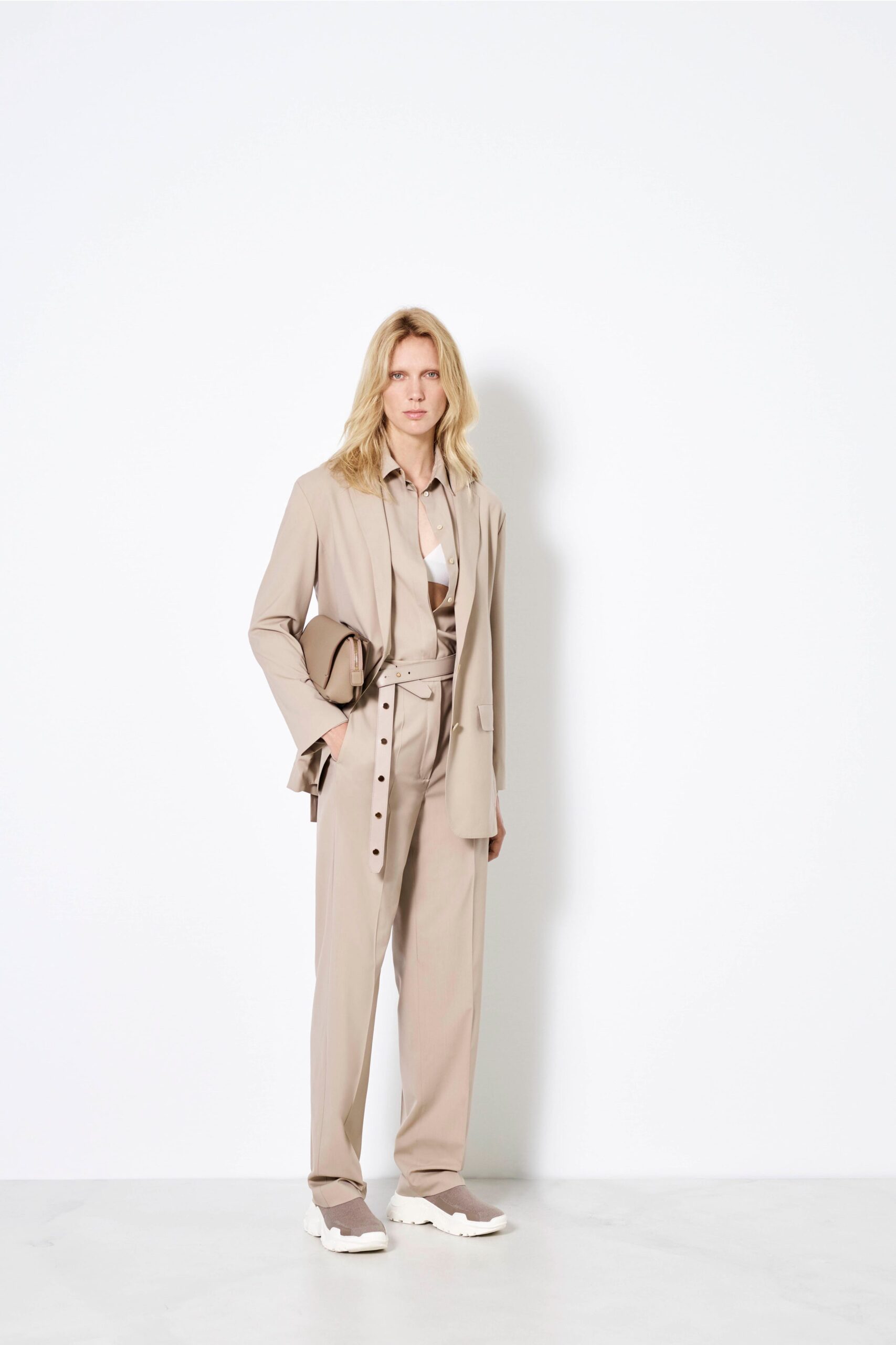 beige tailored suit with white shirt
