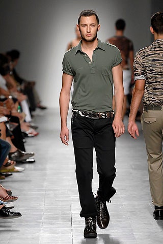 fitted green shirt with black pants