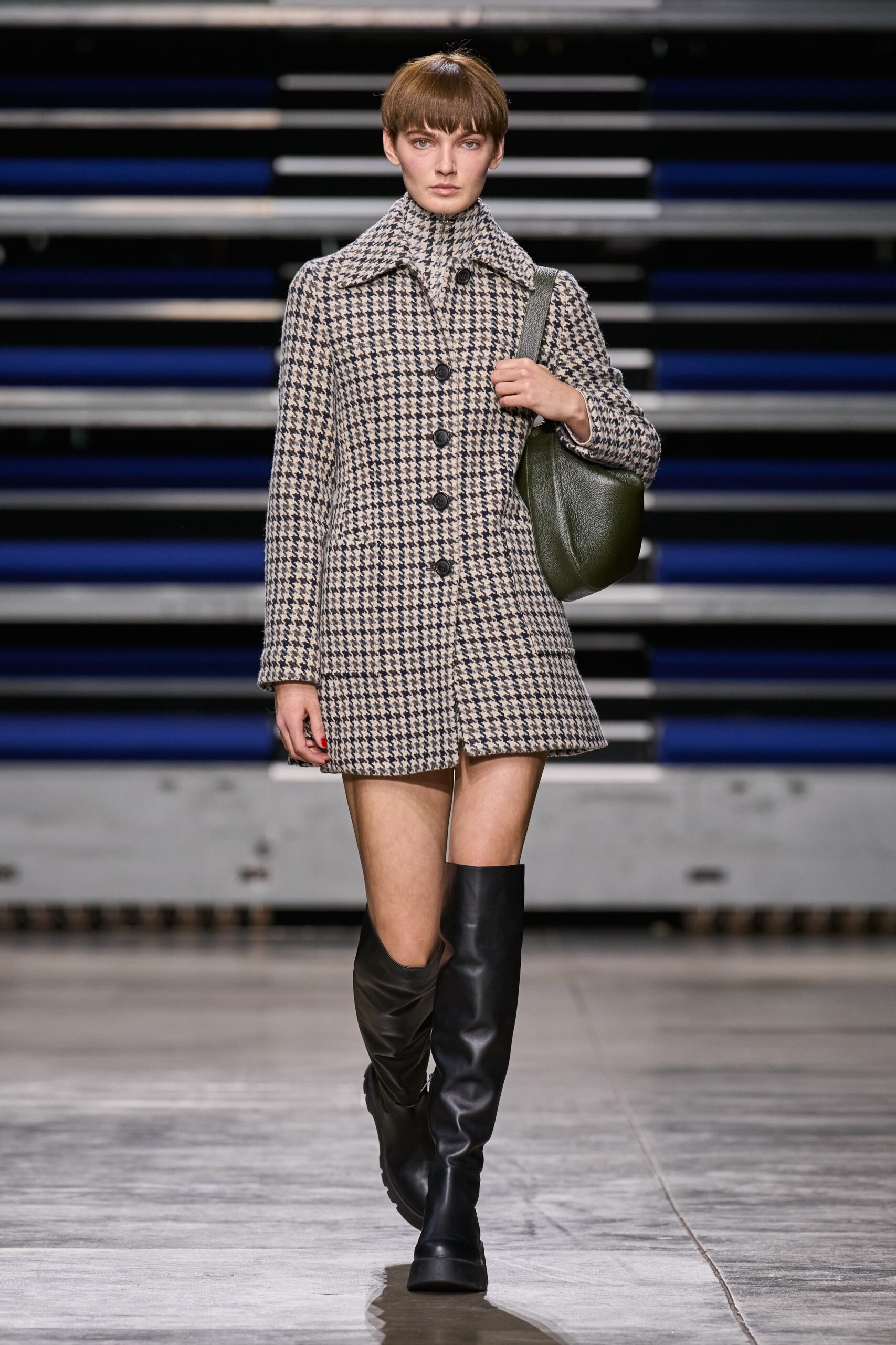 checked wool coat with green bag
