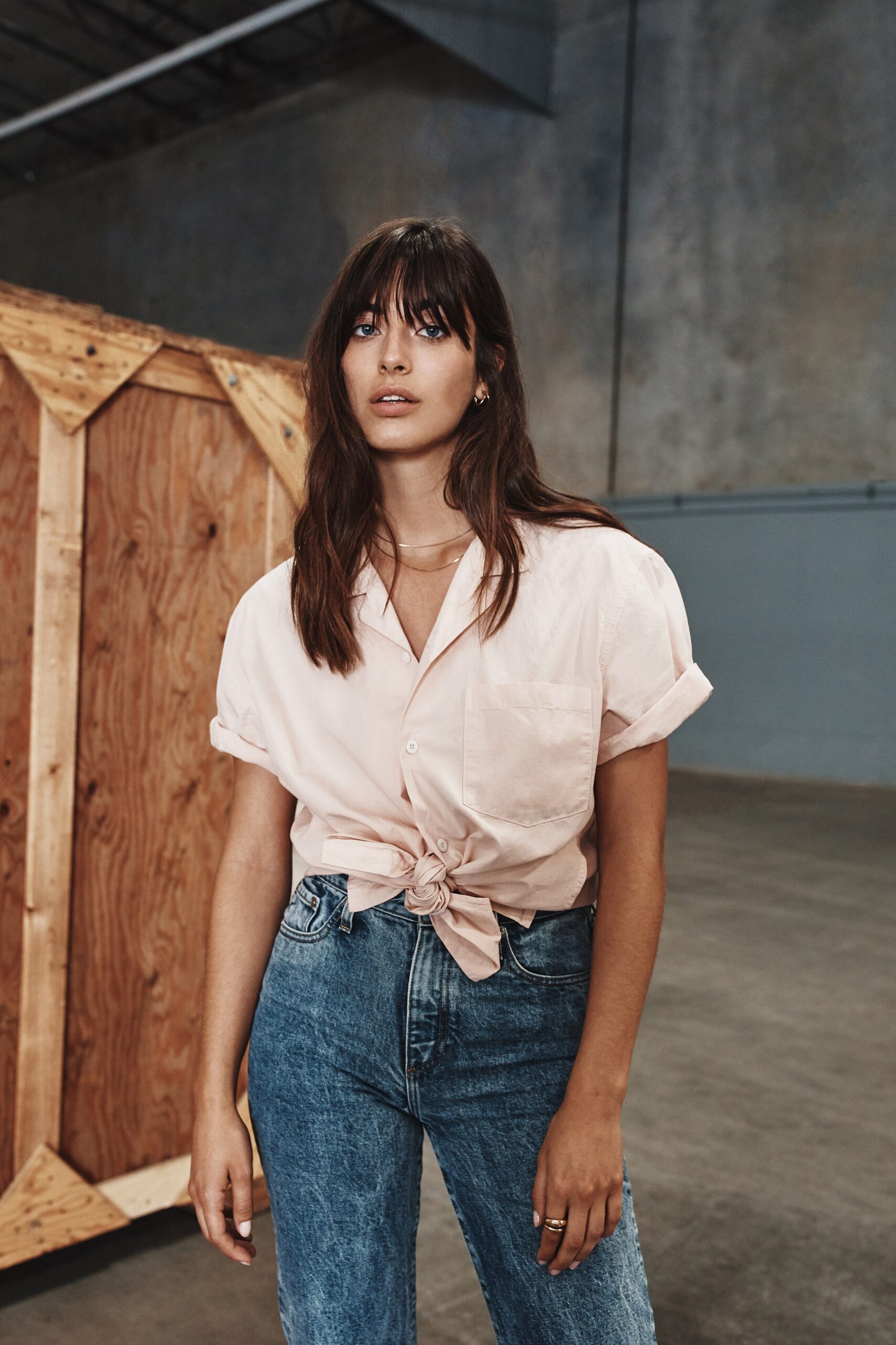 pink relaxed shirt with blue jeans