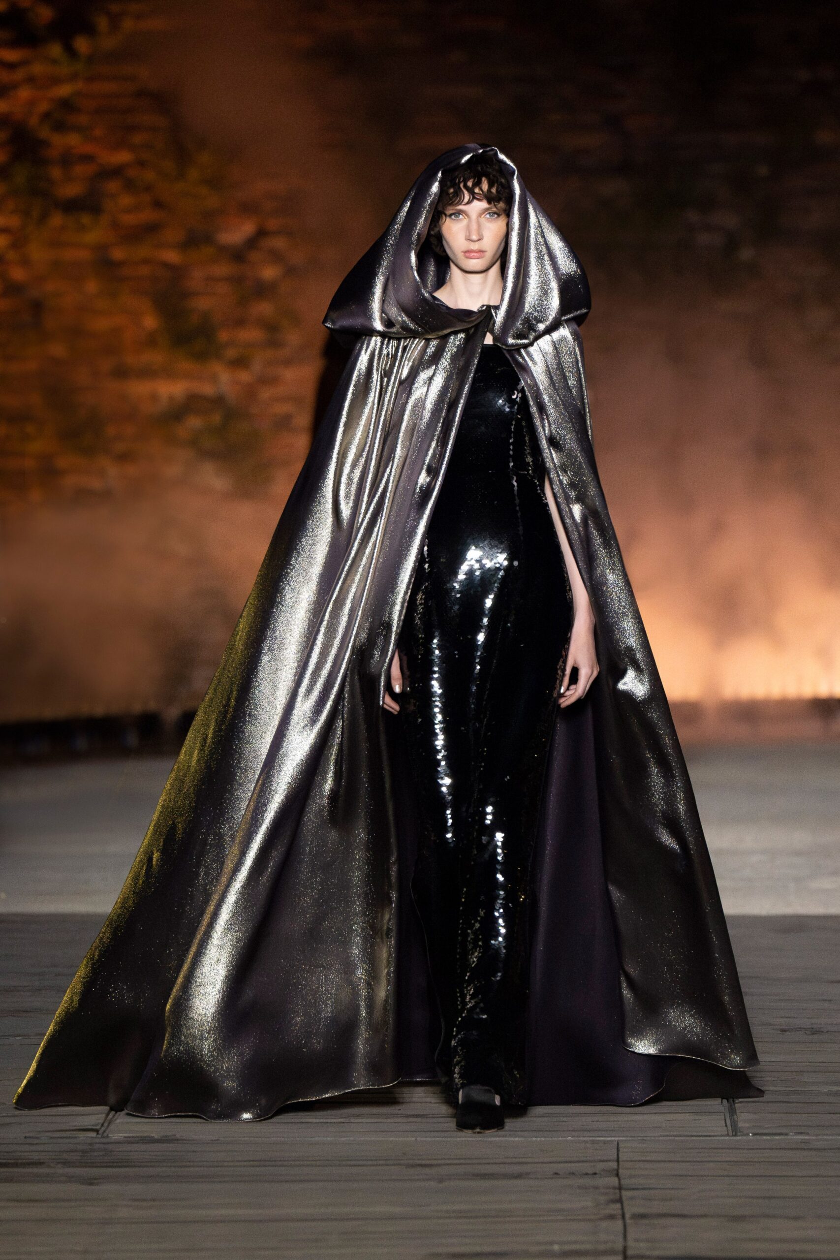 black vinyl catsuit with cape