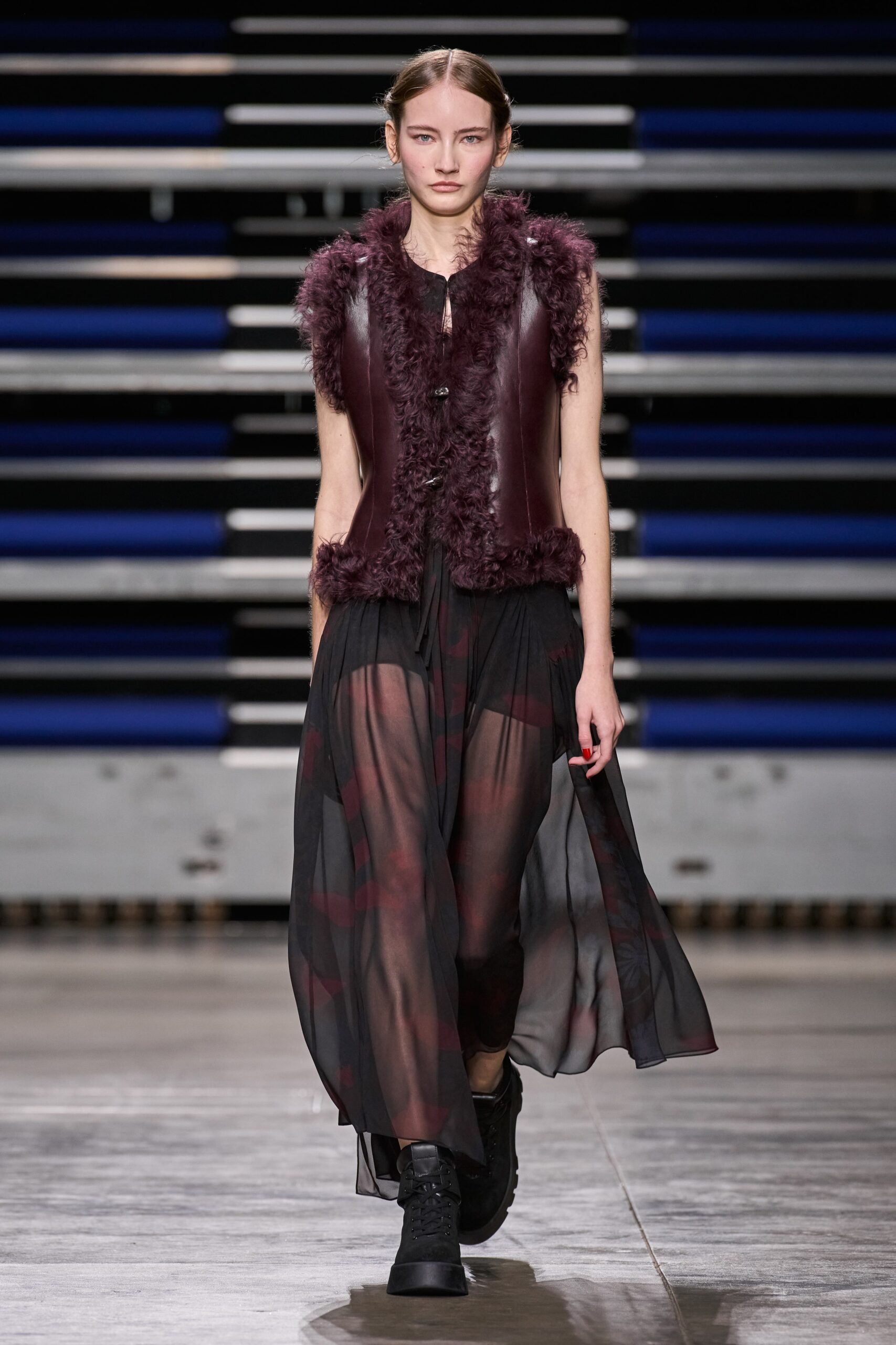 purple fur vest and black chiffon dress