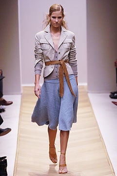 beige fitted jacket with blue midi skirt