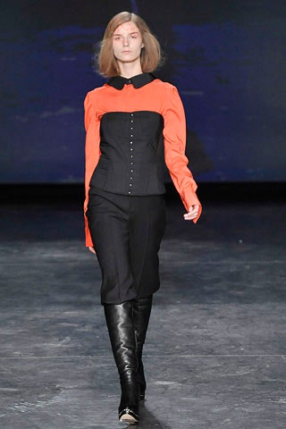 orange fitted blouse black pants