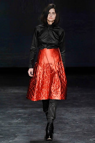 black shirt red pleated skirt