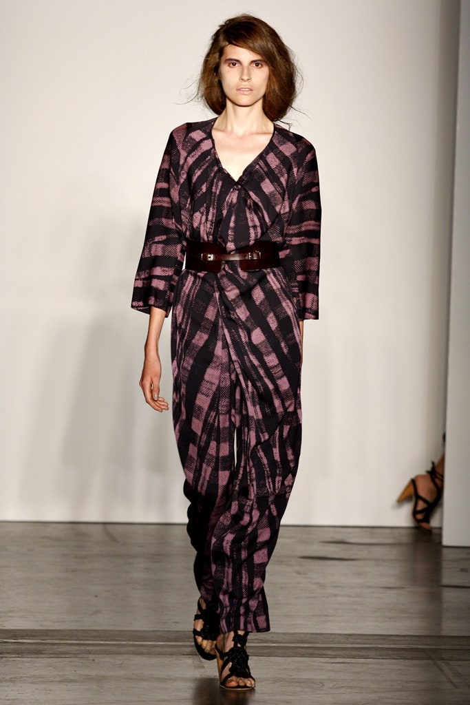 A relaxed black and pink printed dress with long sleeves and a V-neckline.