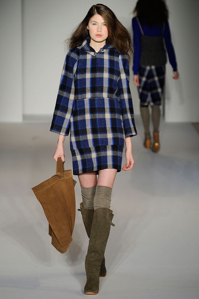 A fitted blue checked dress with long sleeves and a collared neckline.