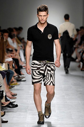 black fitted shirt with striped shorts