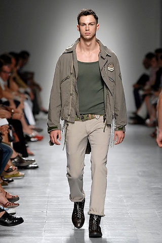 gray jacket green tank-top beige pants