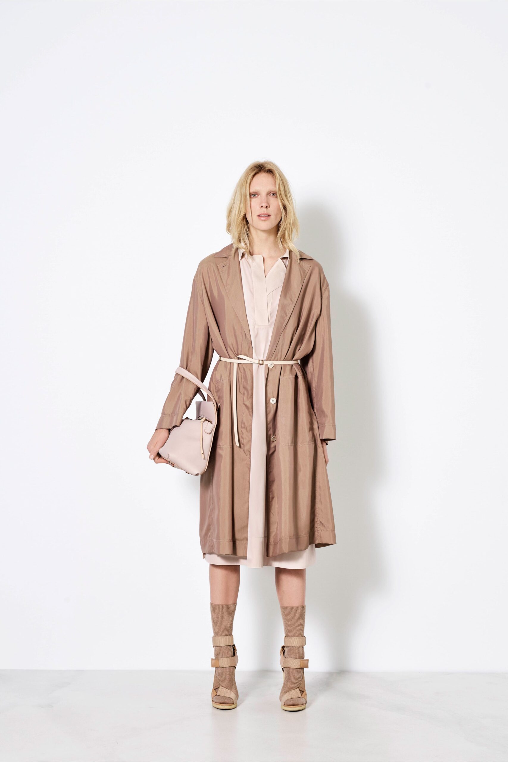 beige silk belted coat and pink dress