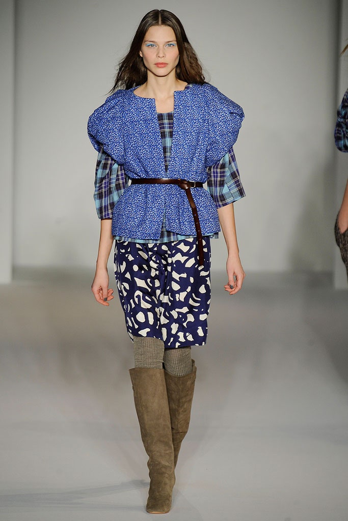 A relaxed blue printed top with short sleeves paired with a layered skirt.