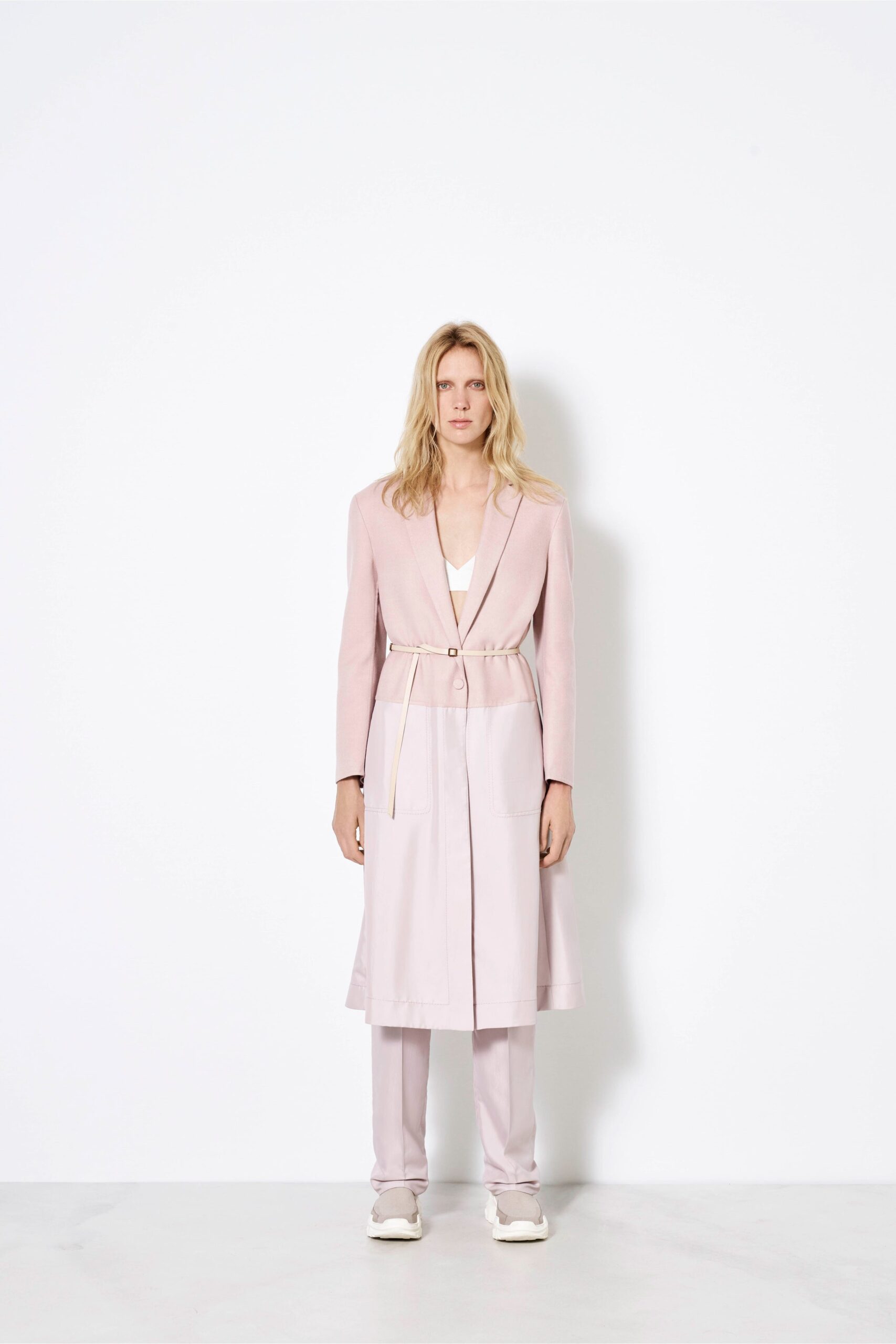 pink tailored blazer with beige pants