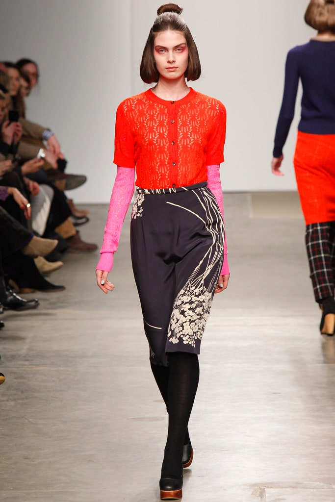 red lace blouse and navy skirt