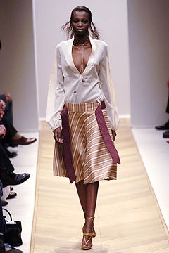 white silk blouse and pleated skirt