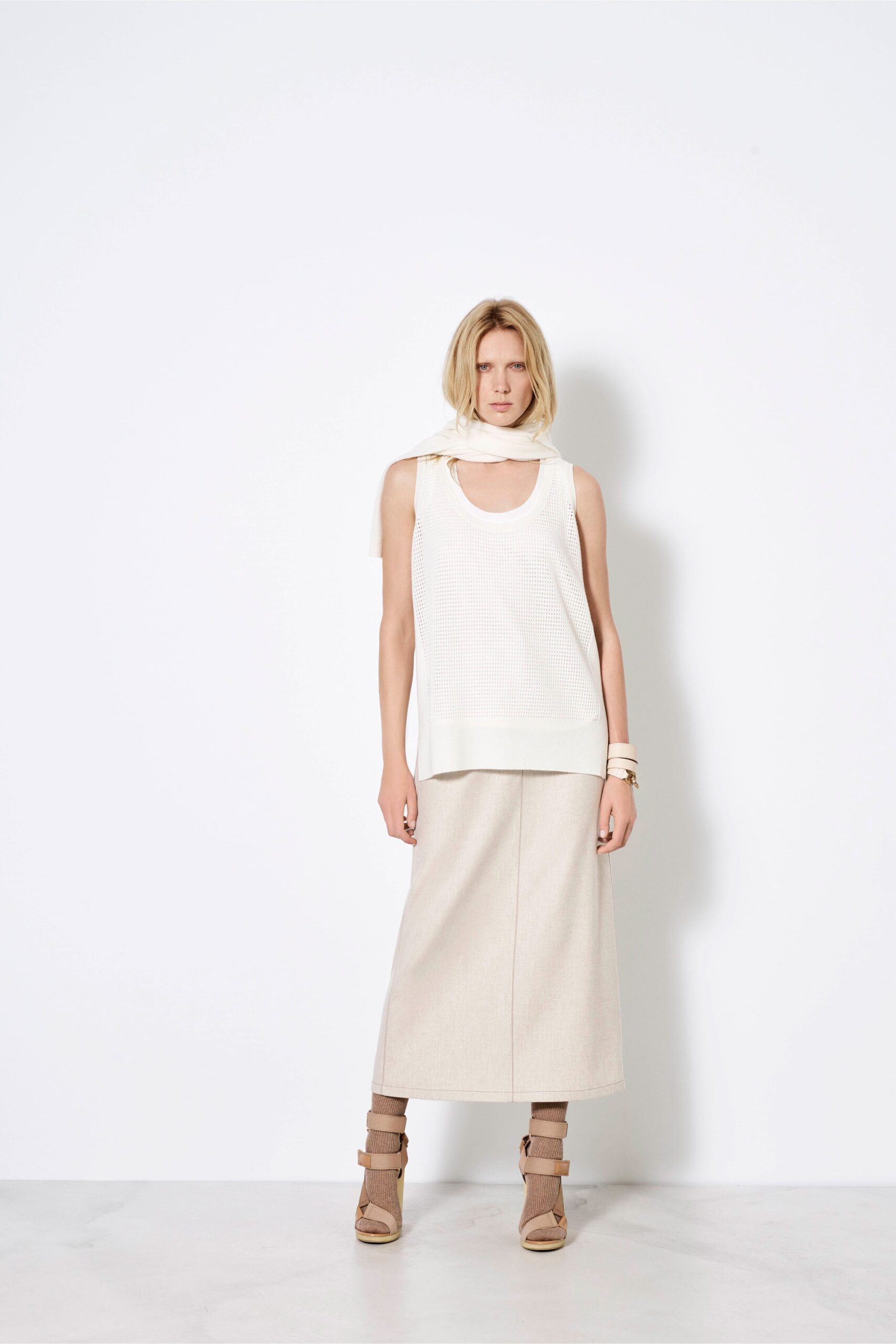 white fitted top with beige midi skirt