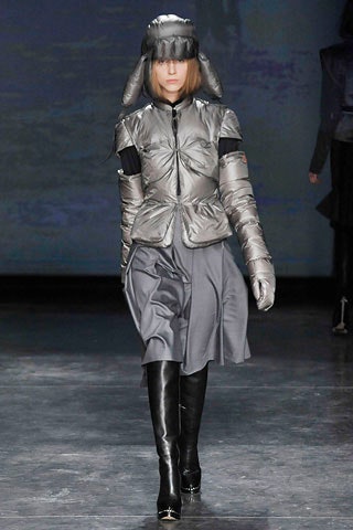 silver fitted jacket with gray skirt
