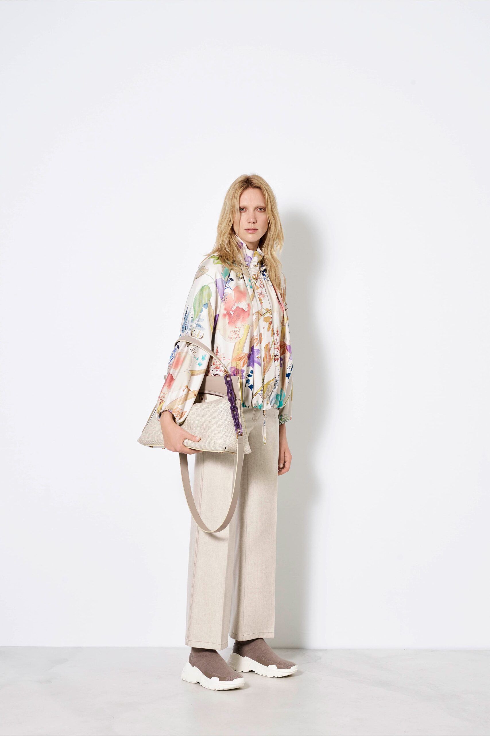 multi-colored silk shirt with beige pants