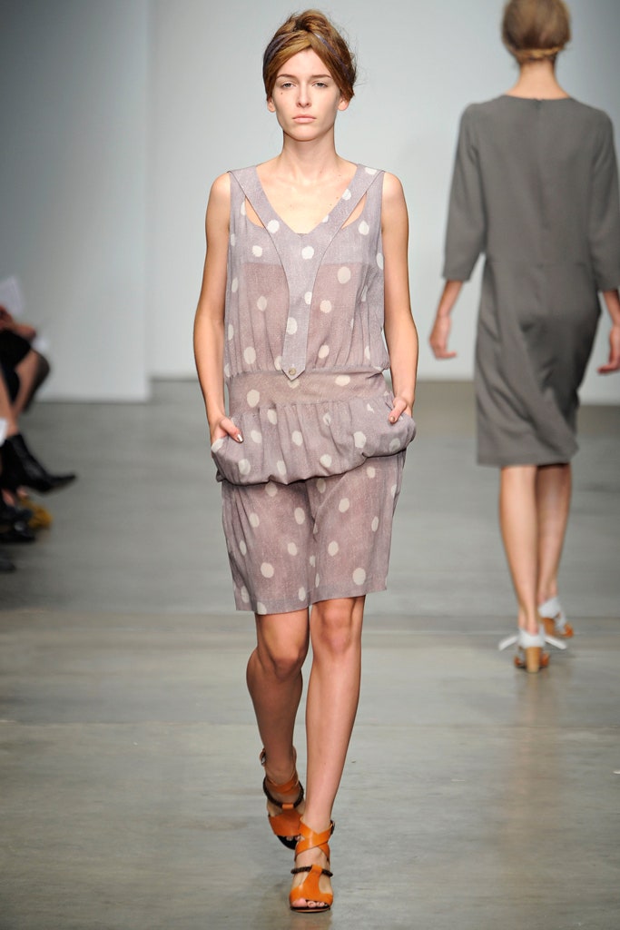 A relaxed gray cotton sleeveless dress with a V-neckline and polka-dot pattern.