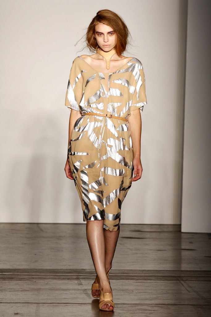 A relaxed beige and silver printed dress with short sleeves and a V-neckline.