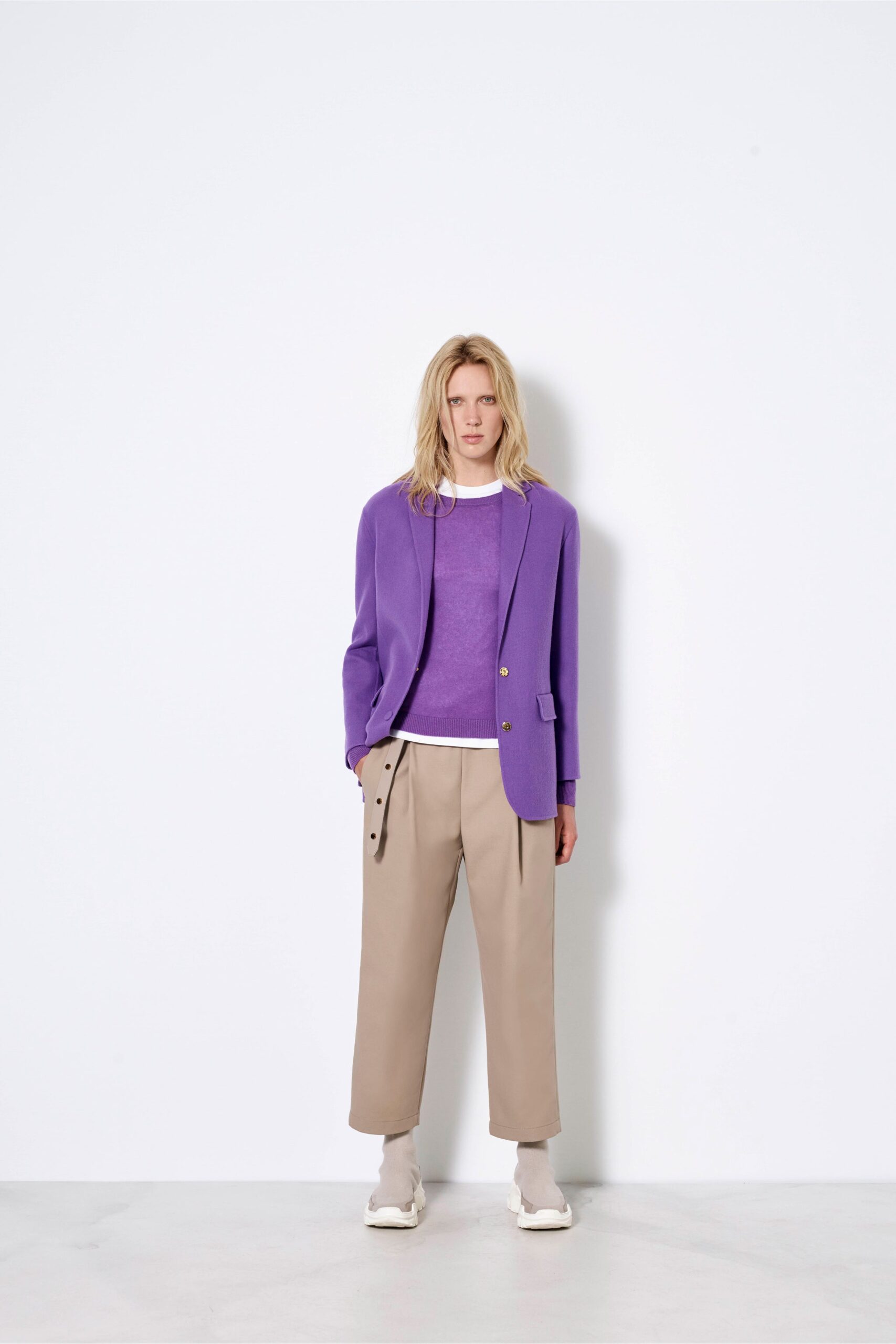 purple blazer and beige pants