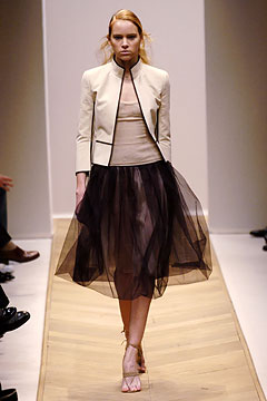 beige fitted jacket with black tulle skirt