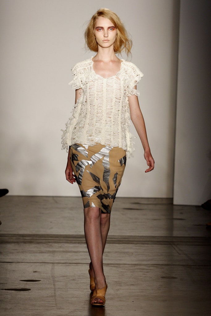A fitted beige ruffled top paired with a multicolor pencil skirt for a chic look.