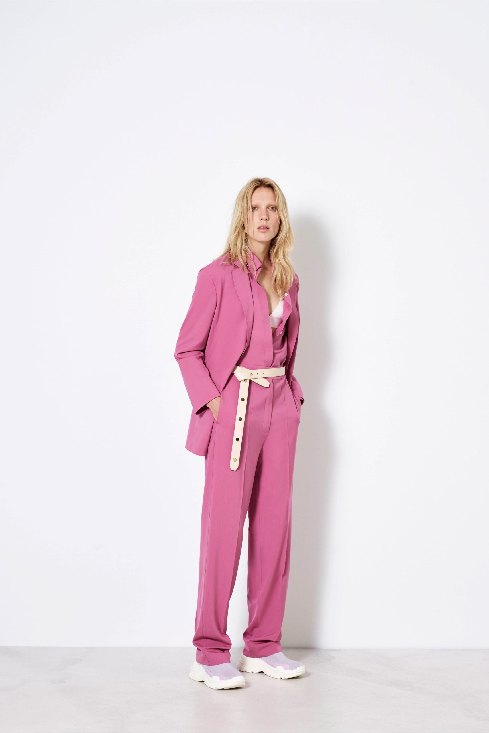 pink tailored suit with white top