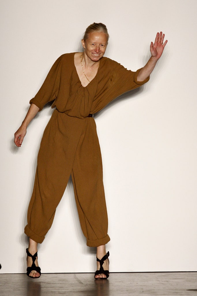 A relaxed brown cotton jumpsuit with a V-neckline and wide-leg silhouette.