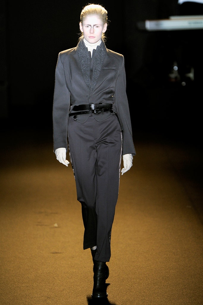 black tailored suit with gloves