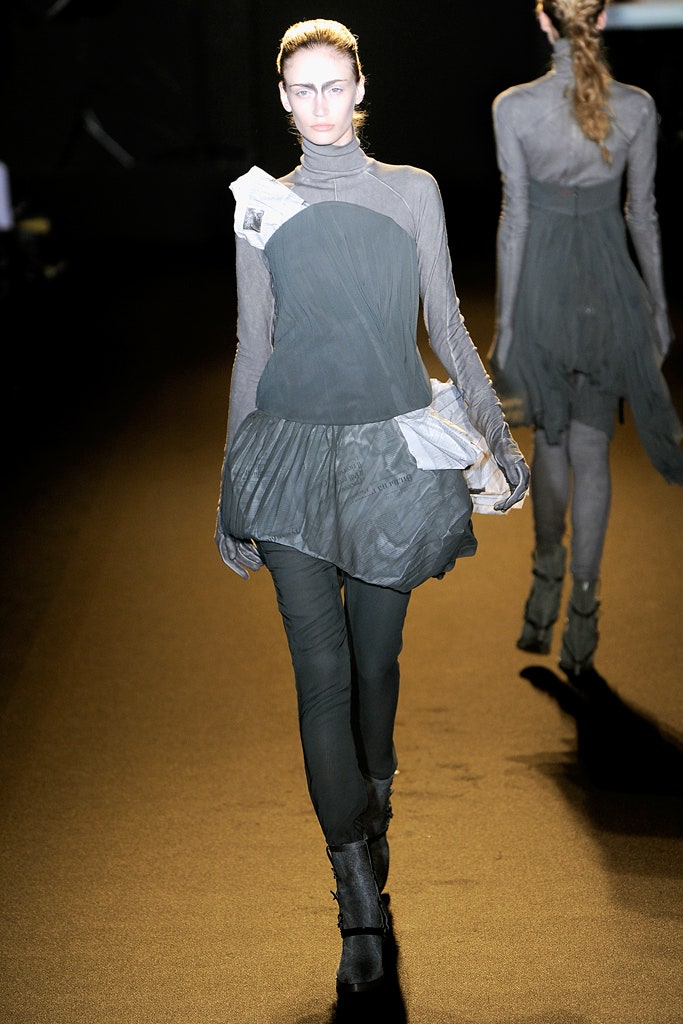 gray silk long-sleeve high-neck fitted draped flowing top