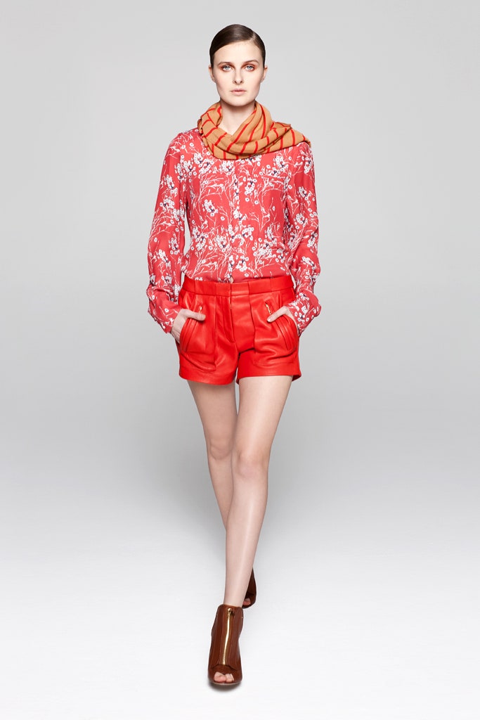 red floral blouse and leather shorts