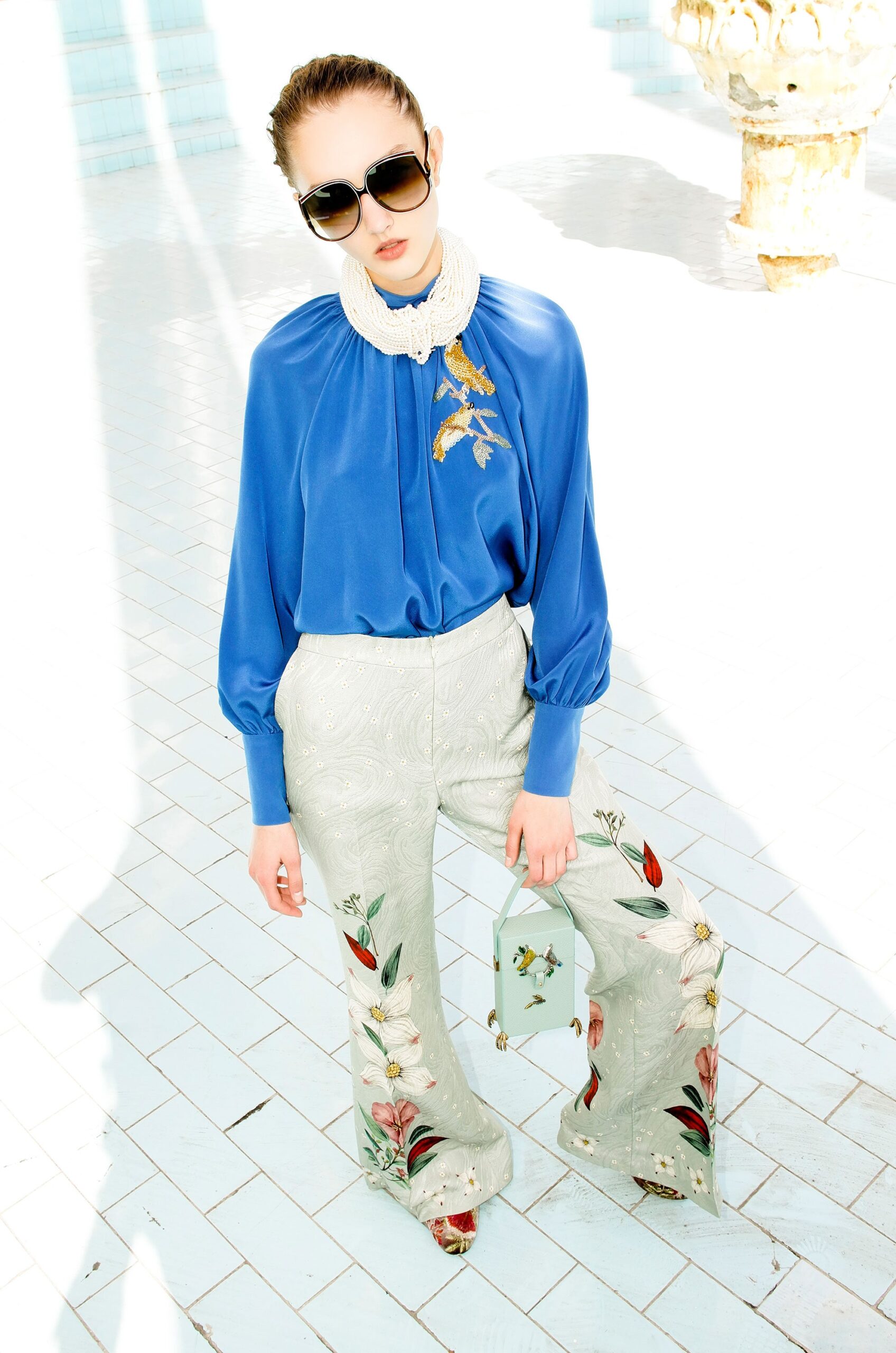 blue silk blouse with embroidered pants