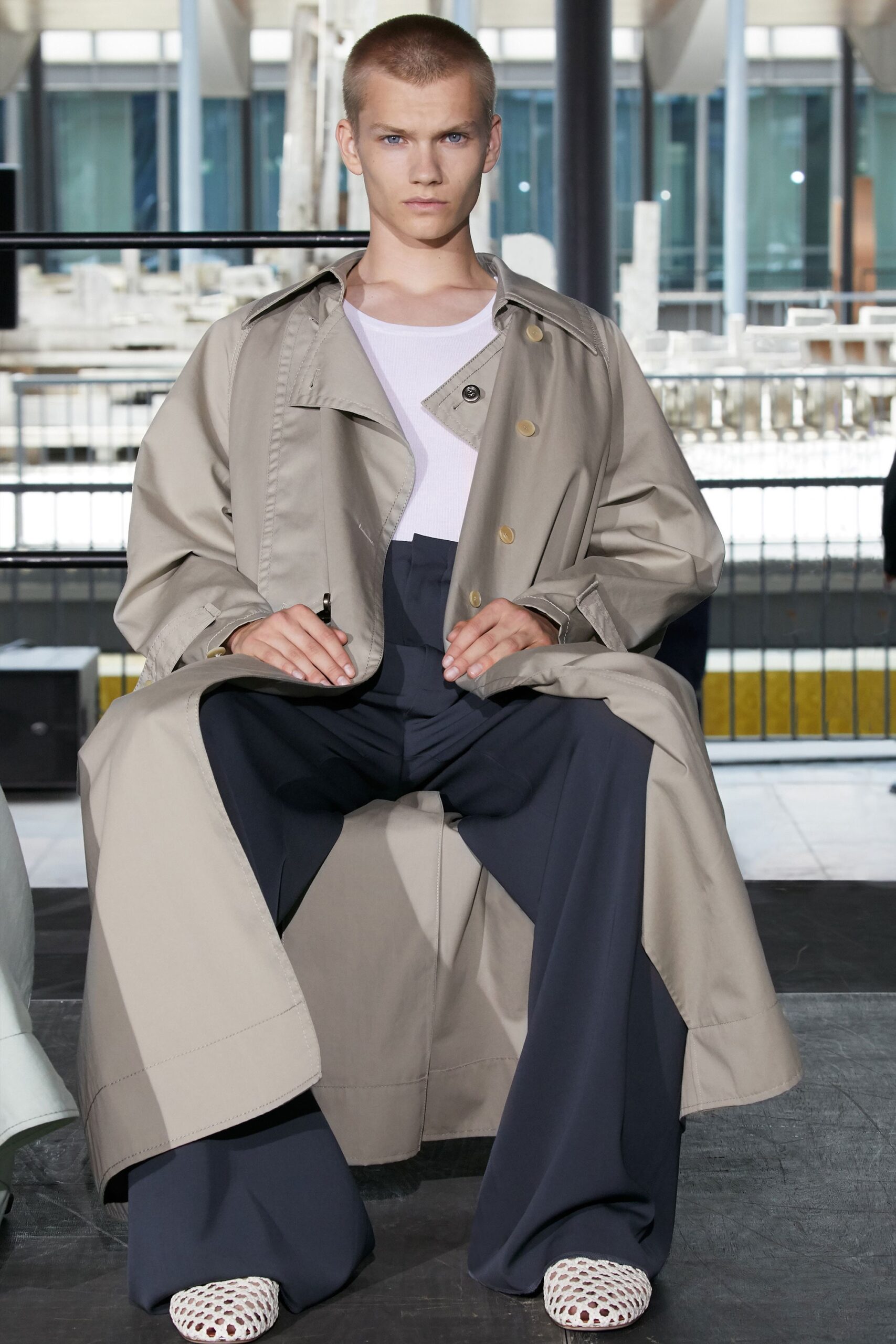 beige trench coat with white top
