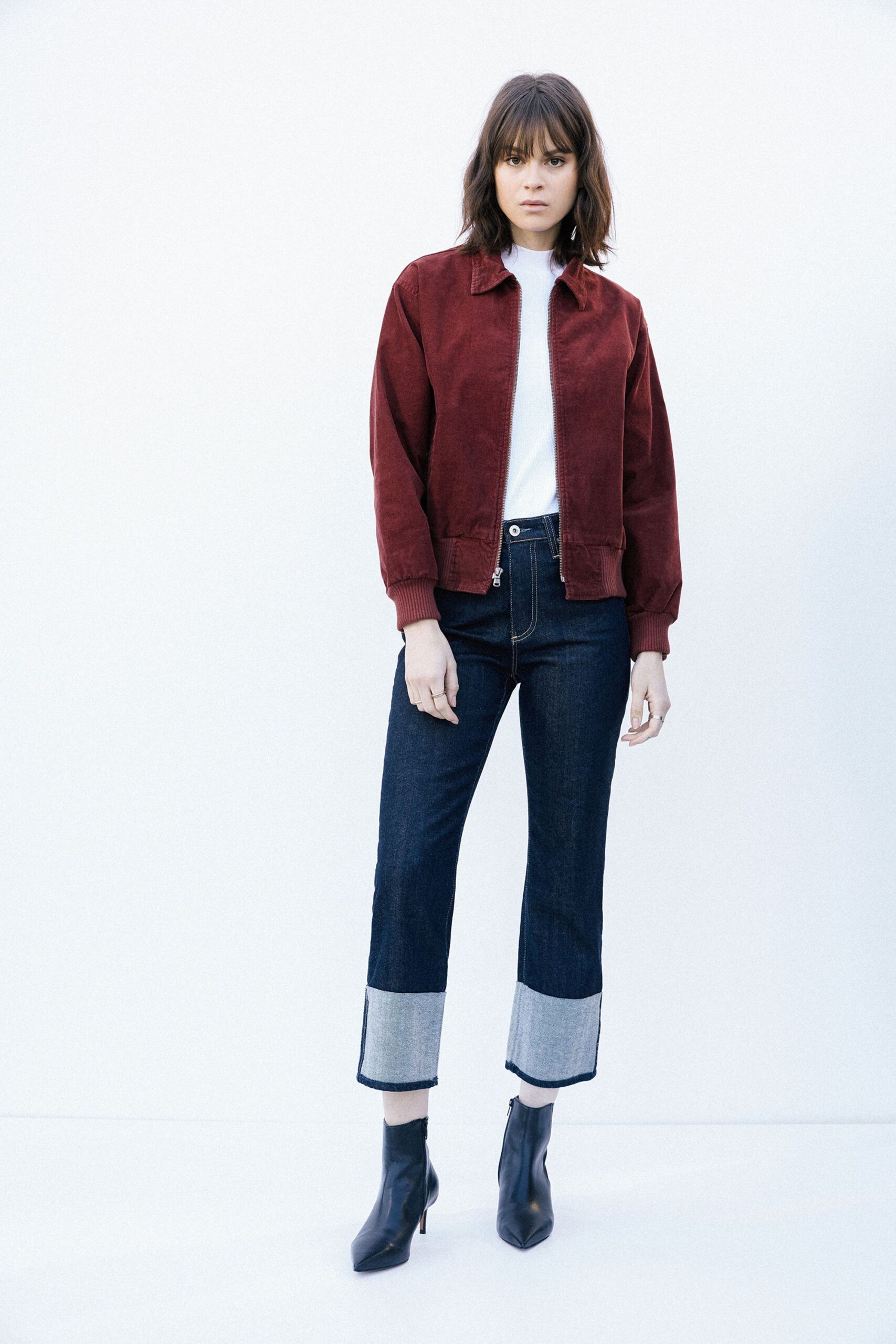 red jacket white top blue pants