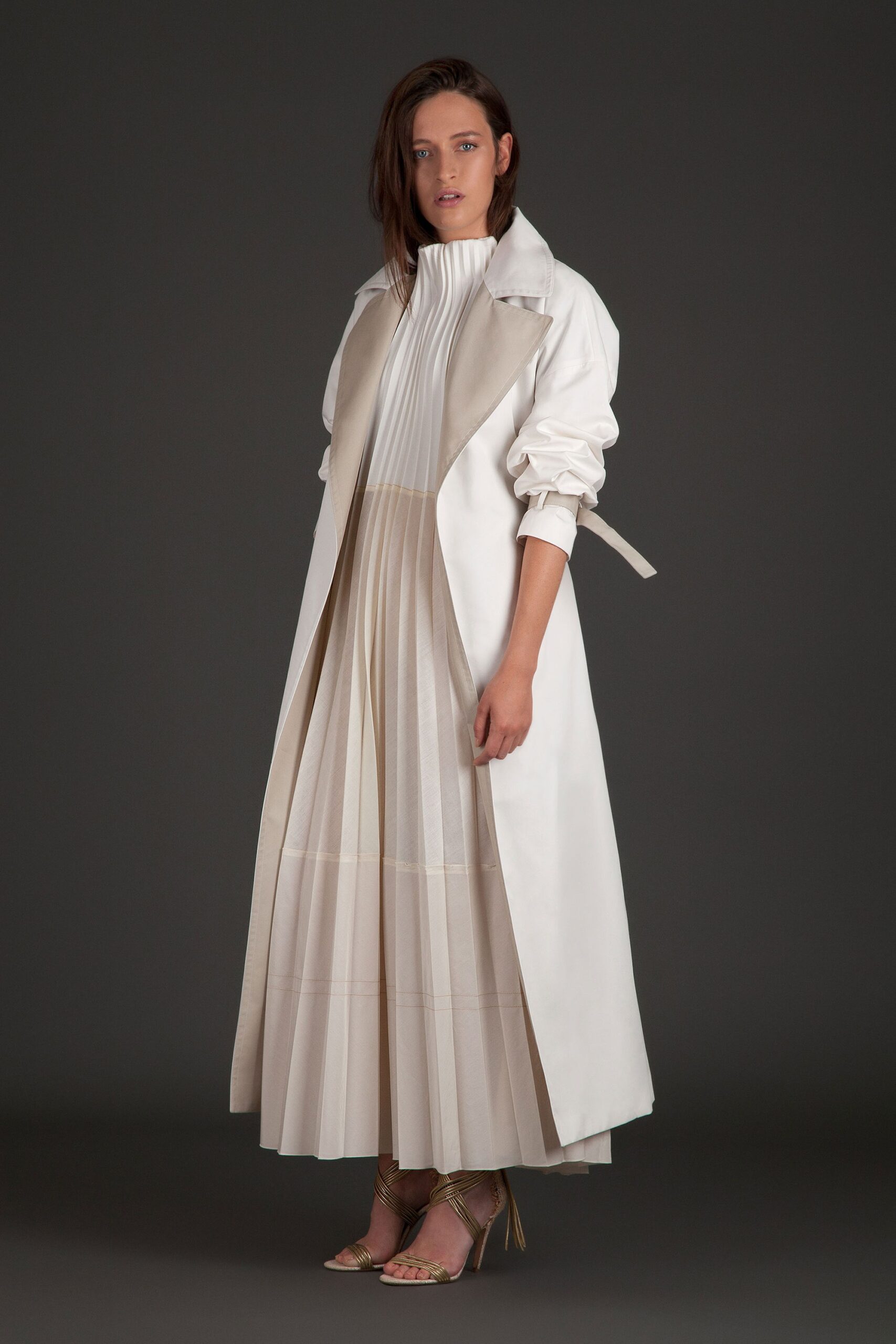 white coat and pleated dress