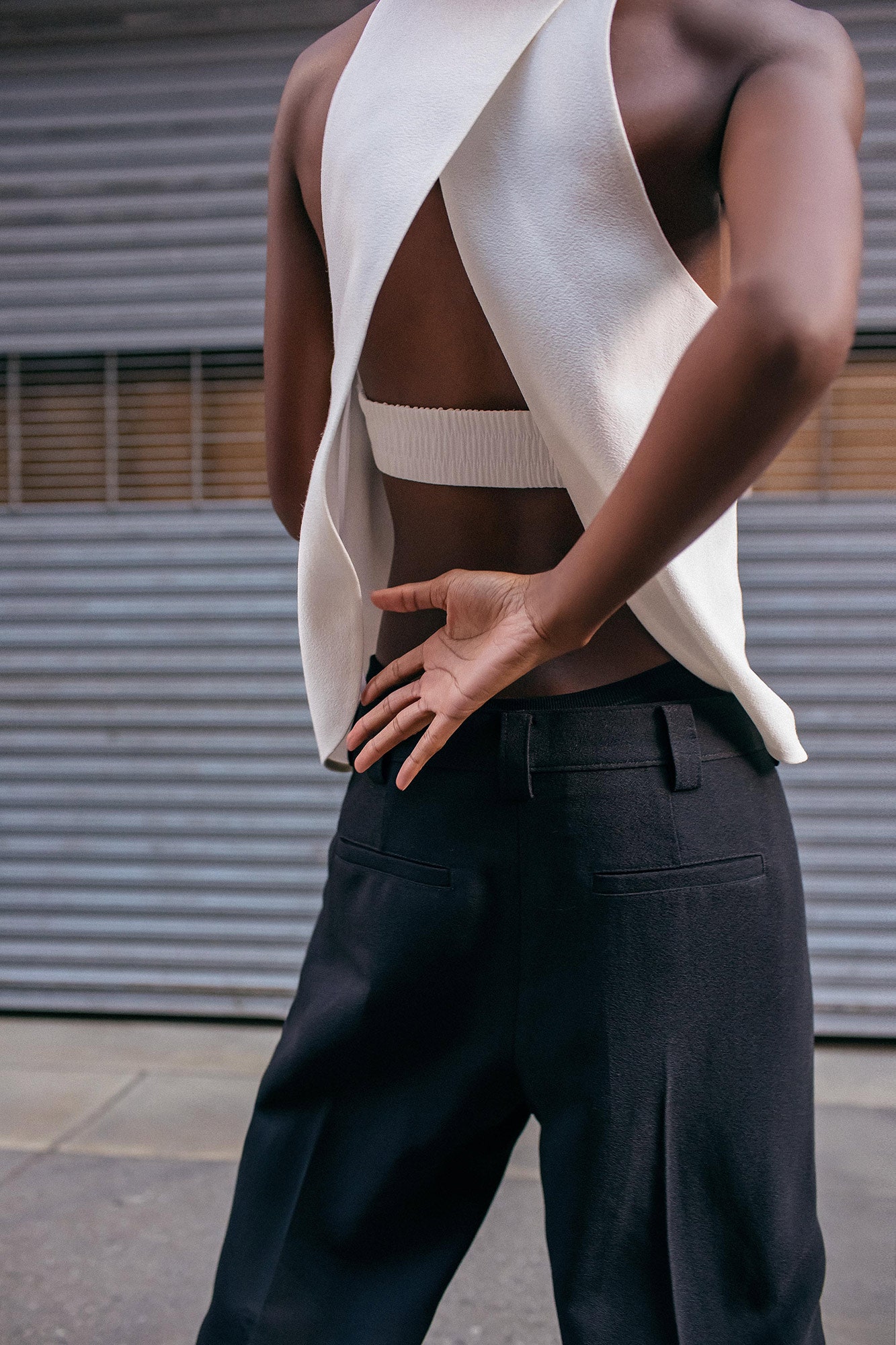 white fitted top and black pants