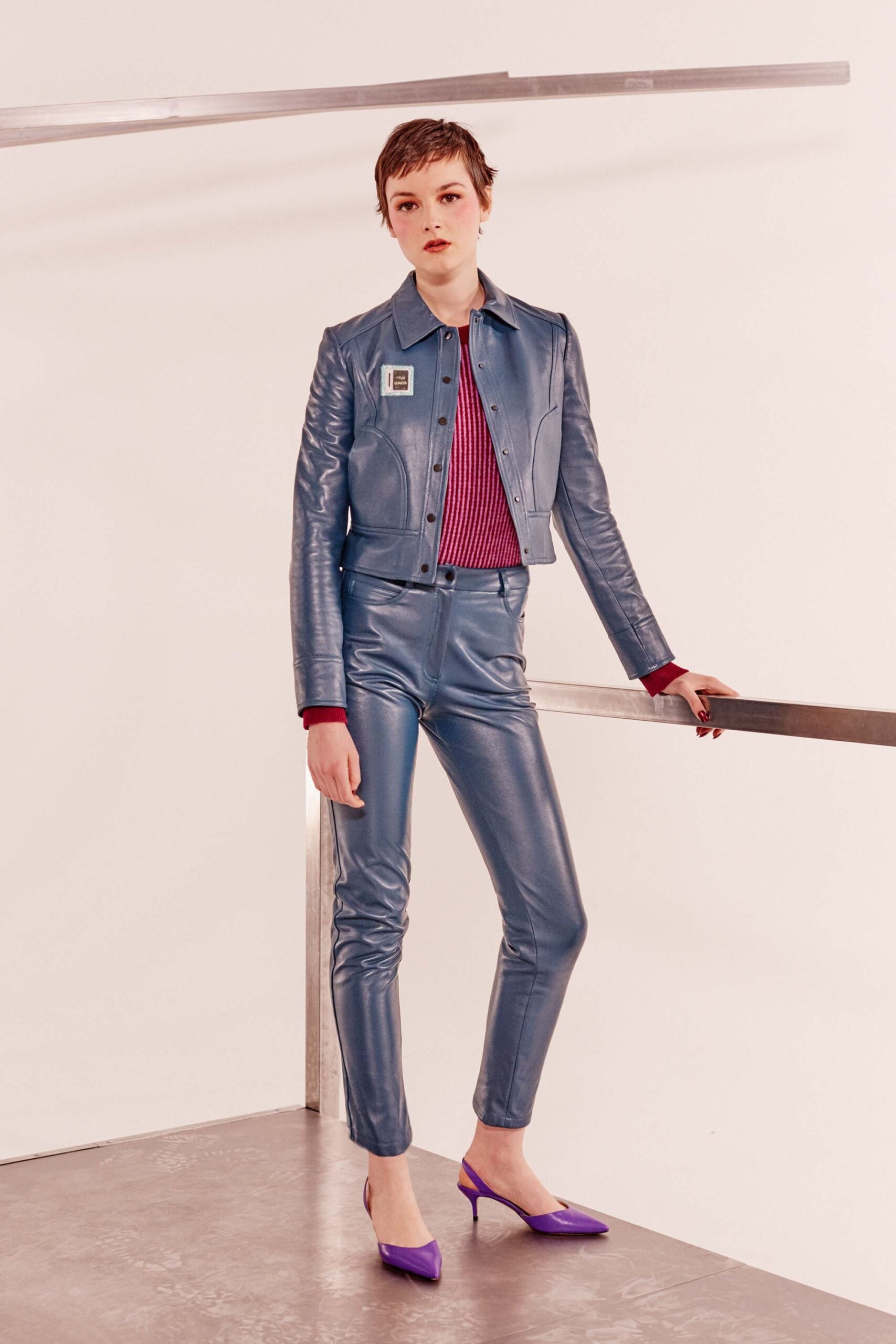 blue leather jacket with fitted pants