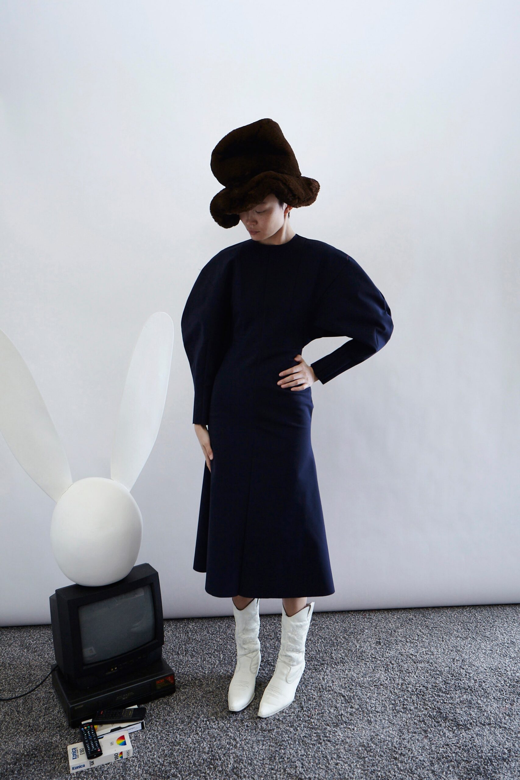 blue fitted midi dress with brown hat