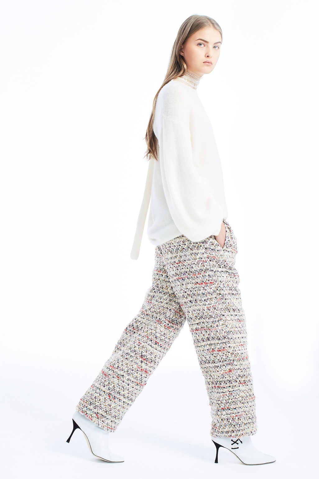 white relaxed sweater with multi pants