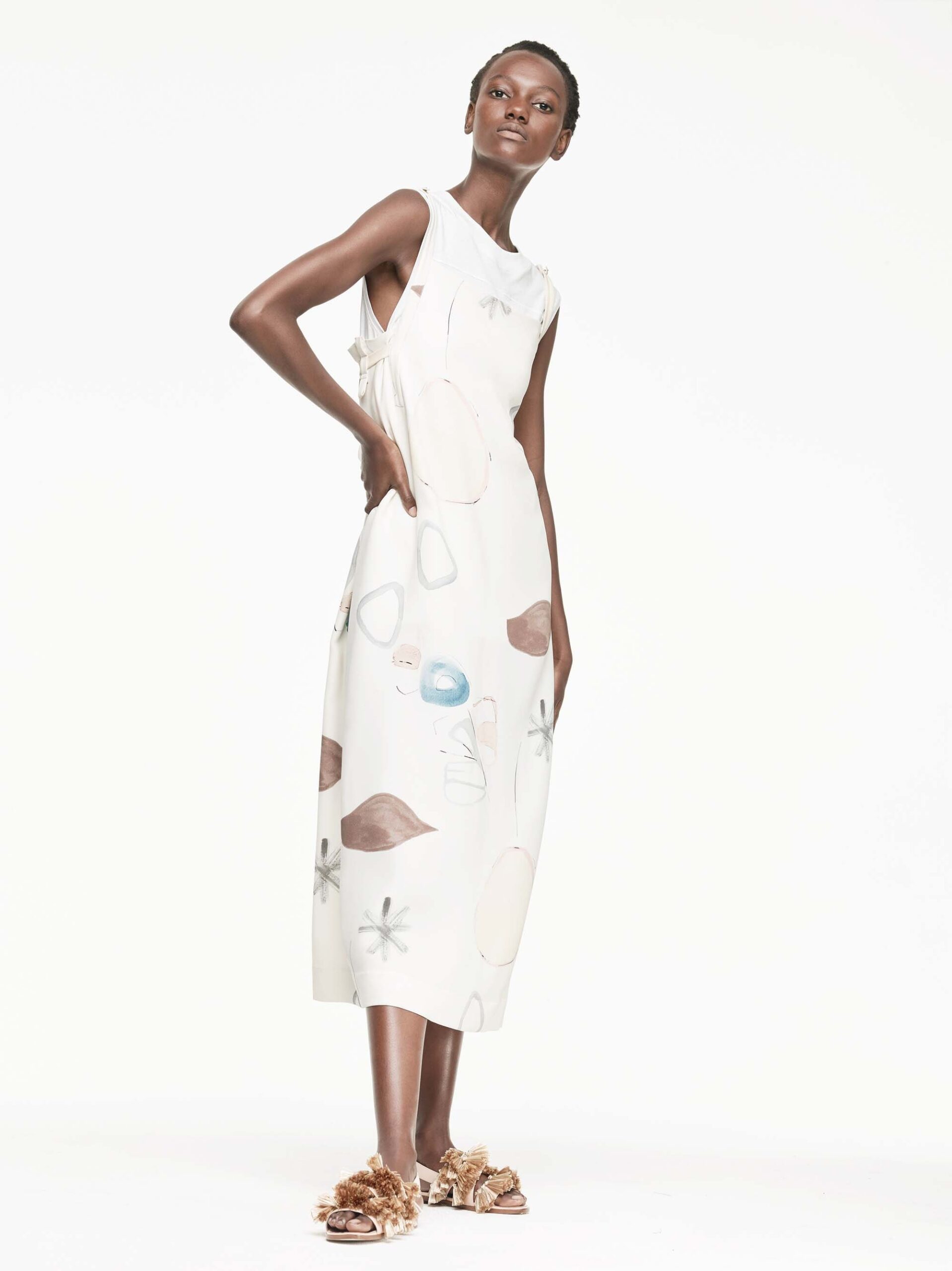 white printed midi dress with embellished shoes