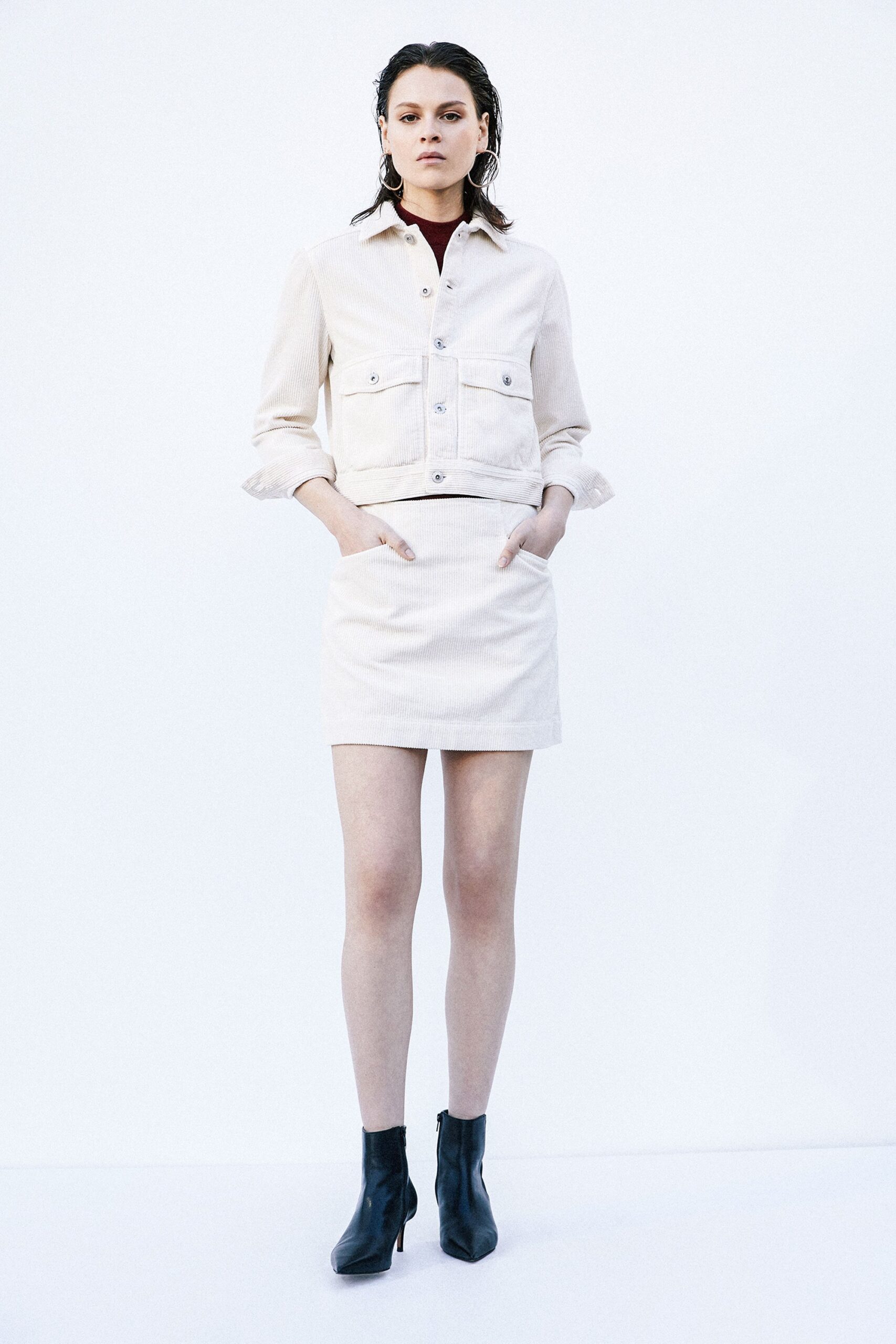 beige fitted jacket and mini skirt