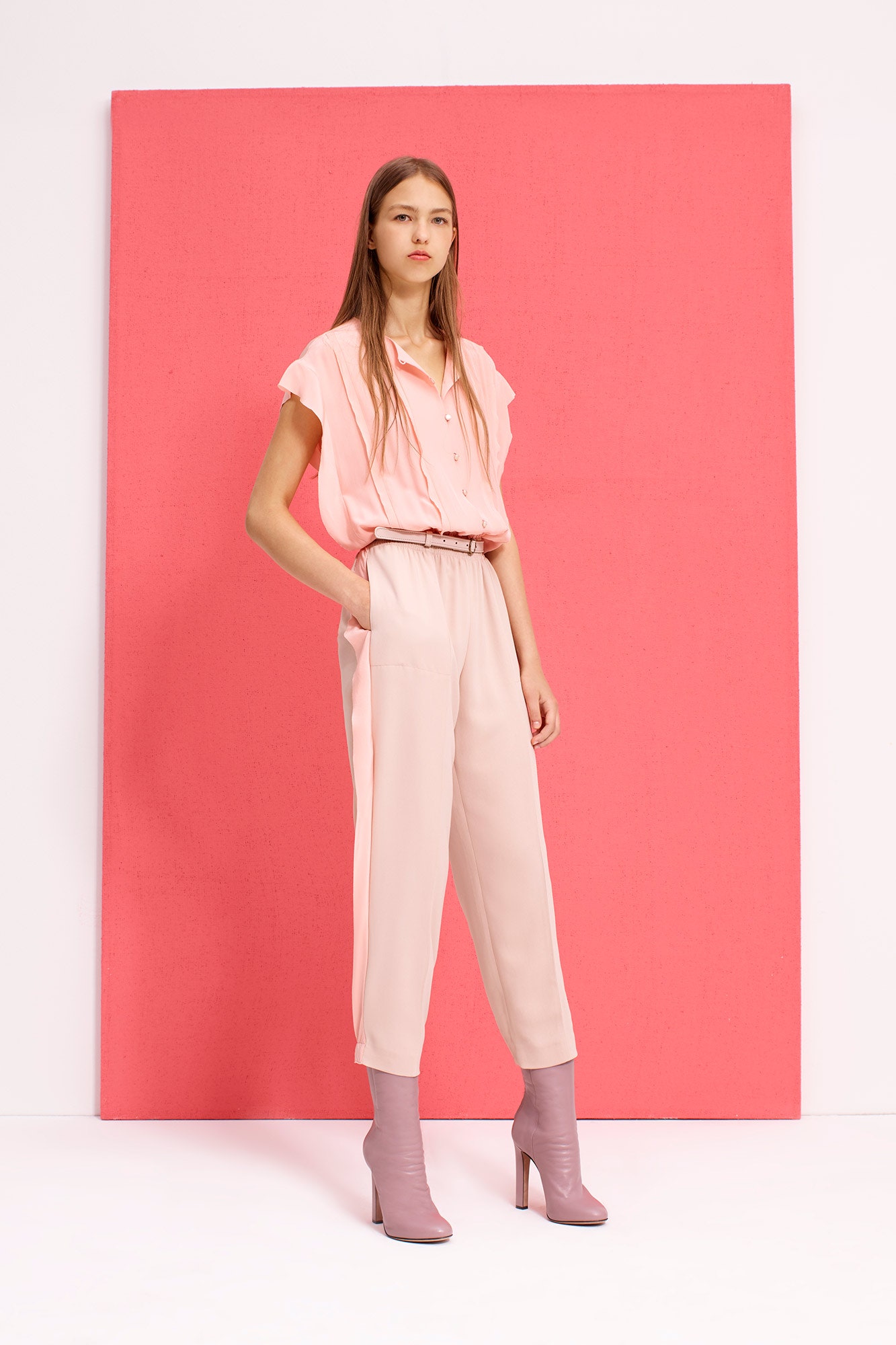 pink relaxed top with beige pants