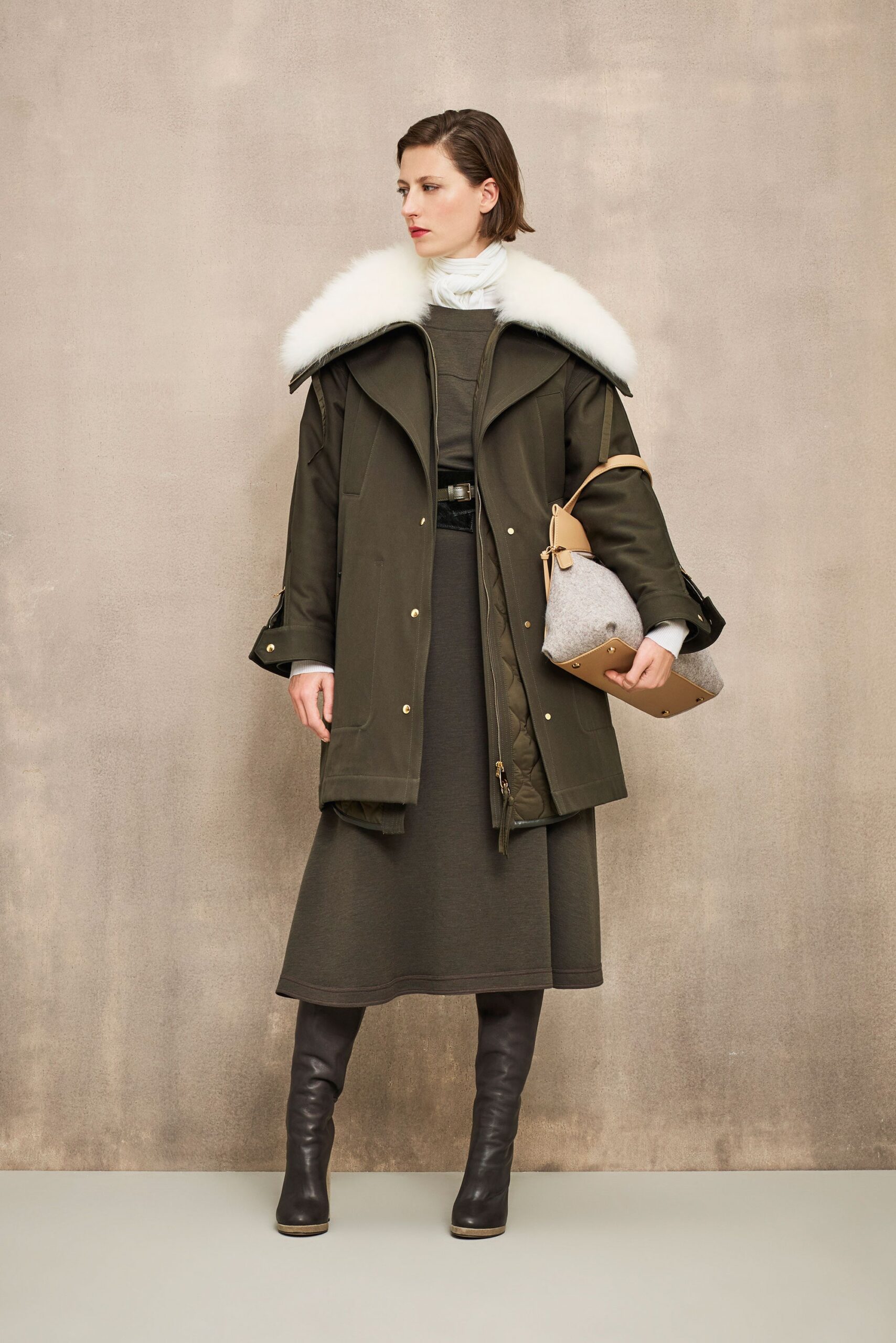 green coat gray dress brown boots