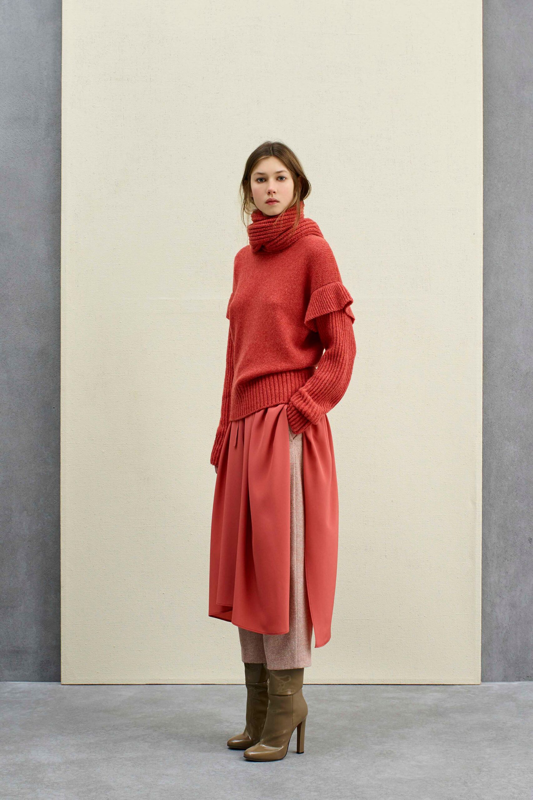 red wool relaxed sweater with pink pleated skirt