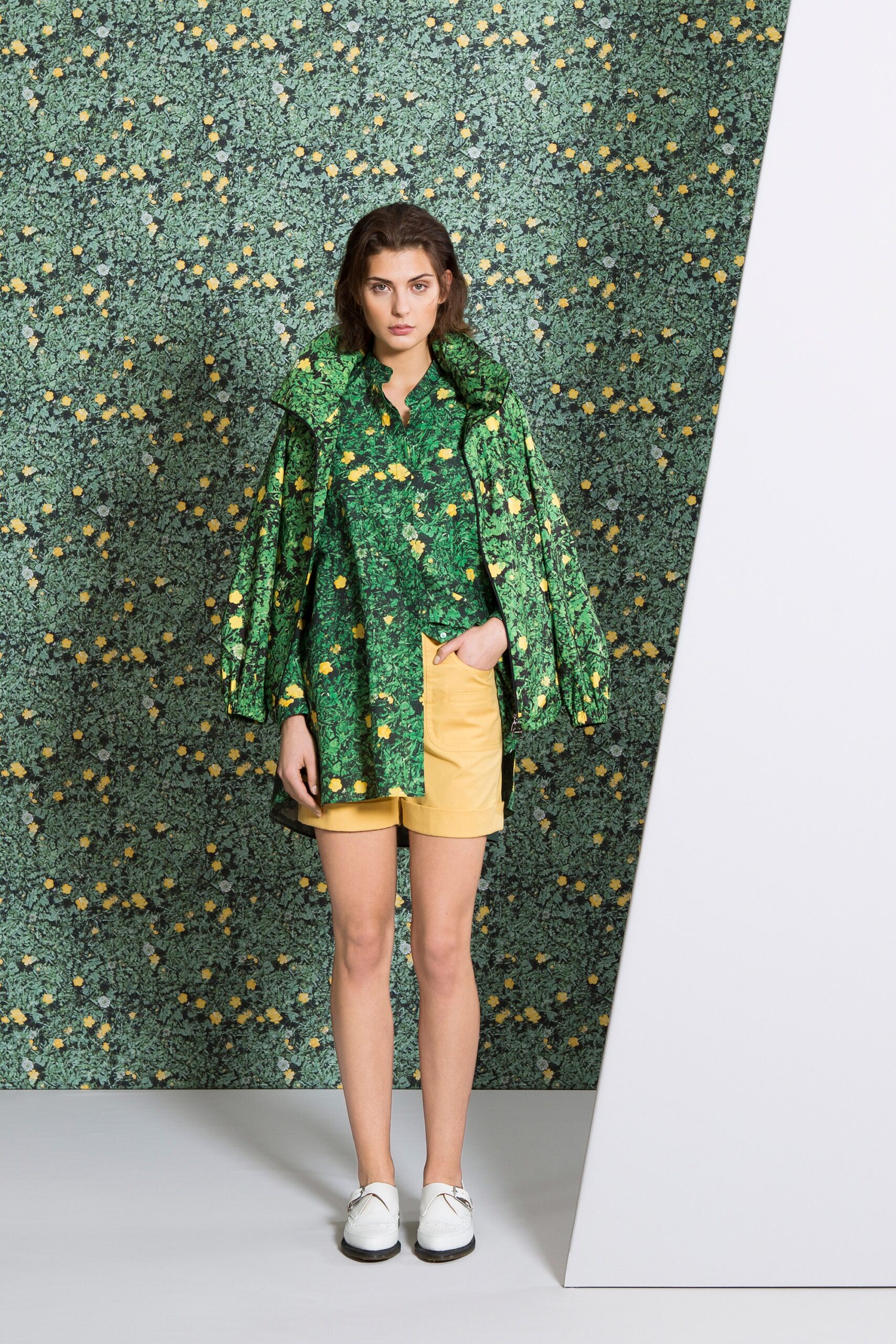 green printed shirt with yellow shorts