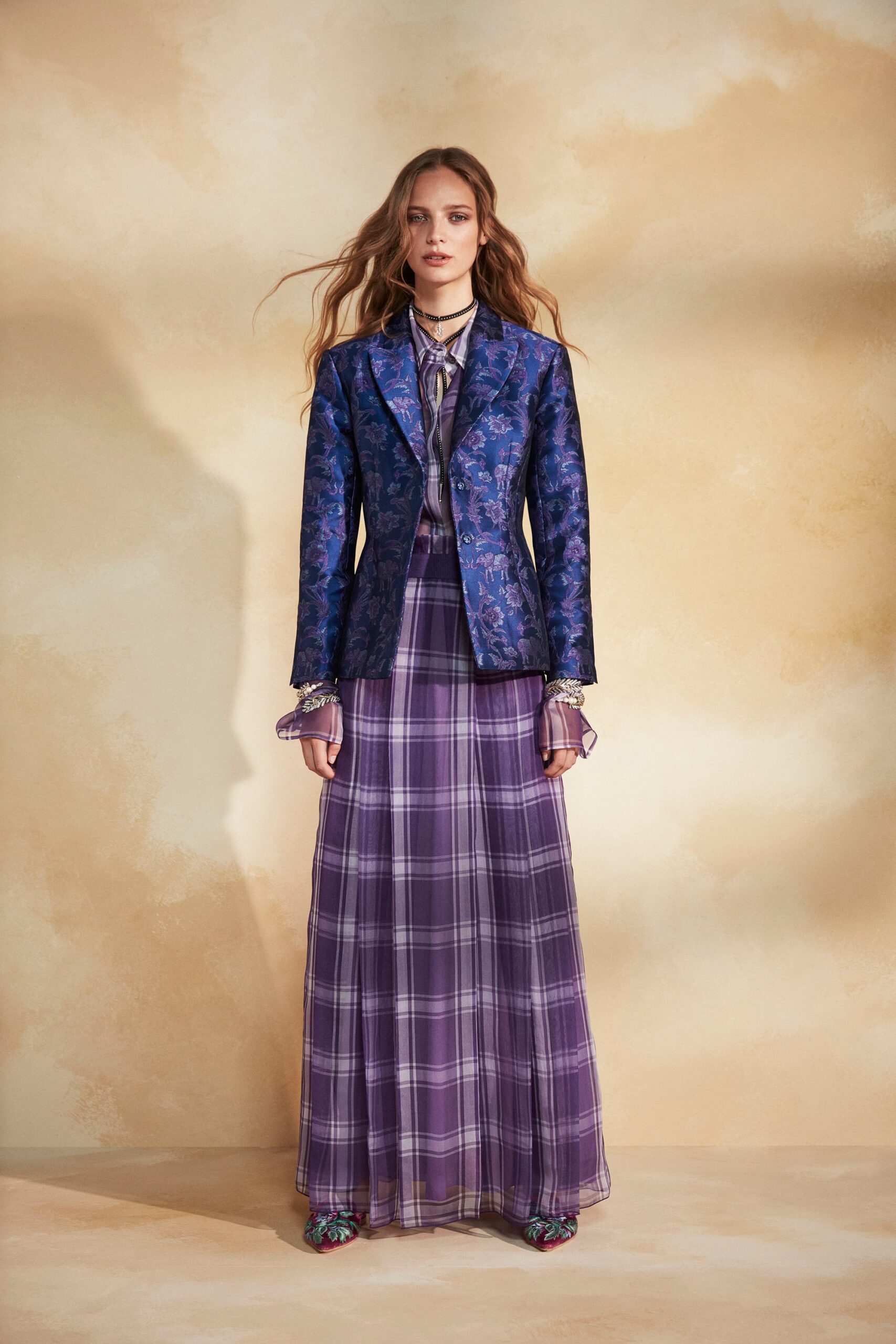 purple chiffon sleeveless v-neck fitted pleated flowing gown