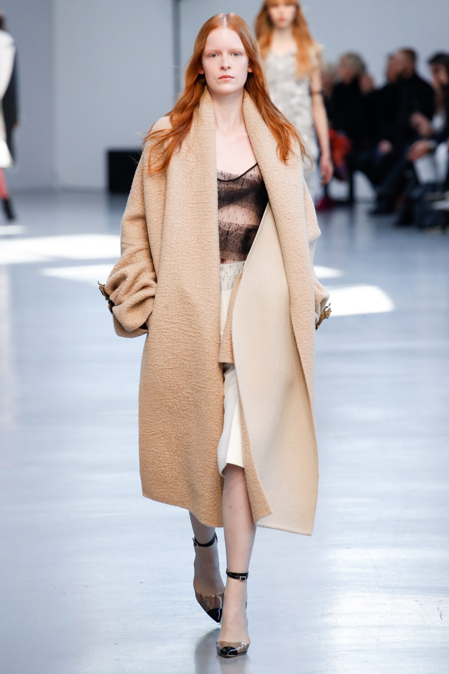 beige wool coat with black top