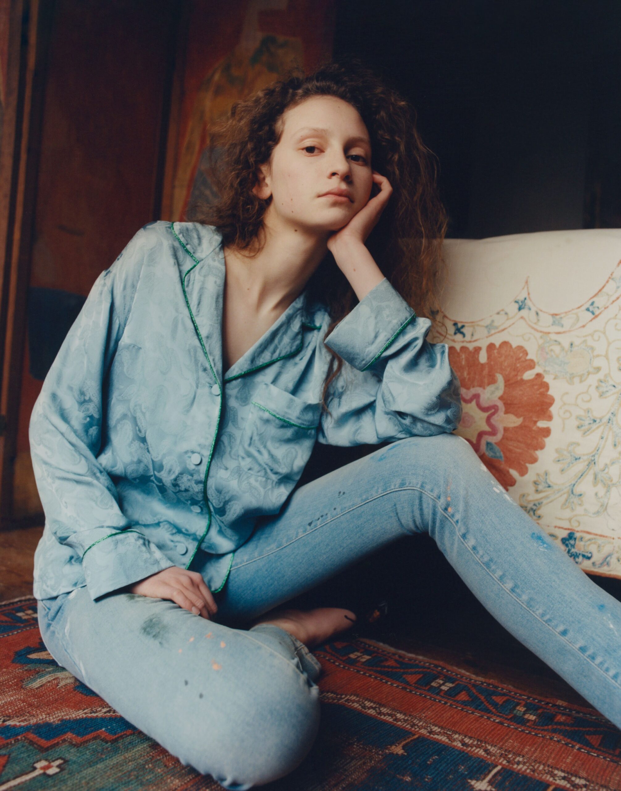 blue silk shirt and distressed jeans