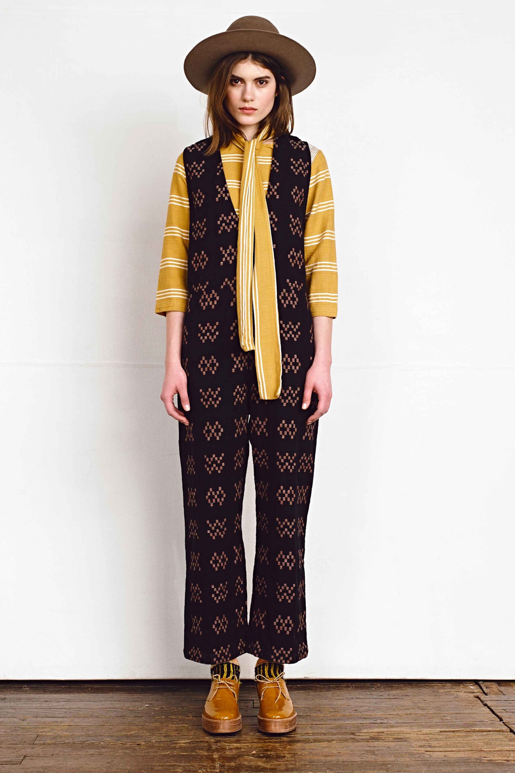 black printed vest with yellow shirt