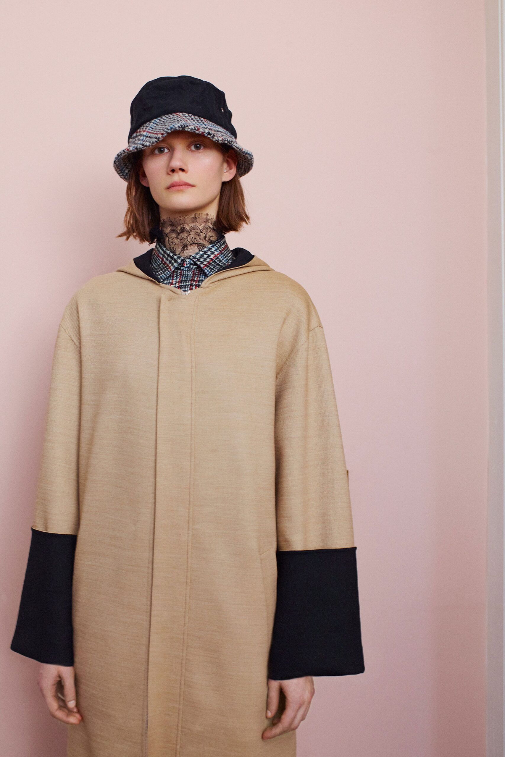 beige relaxed coat with bucket hat